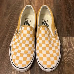 Yellow and white slip on checkerboard vans